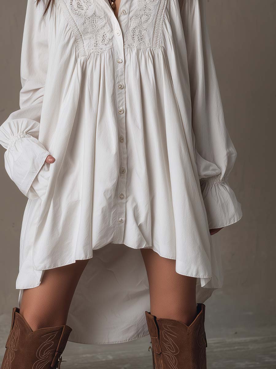 vestido mini de encaje con mangas largas y bajo irregular. Begur