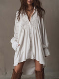 vestido mini de encaje con mangas largas y bajo irregular. Begur