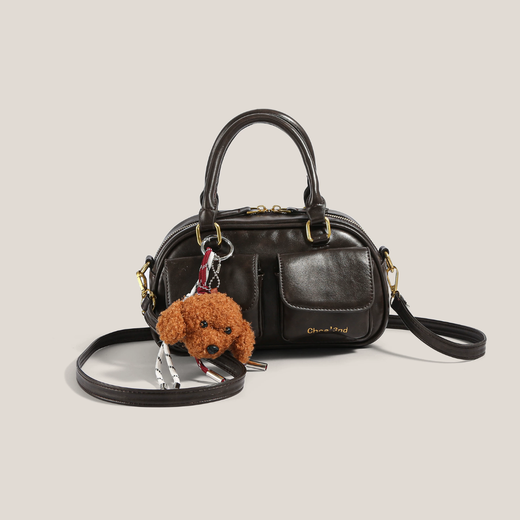 bolso de mano compacto con bolsillo frontal. Phoebe