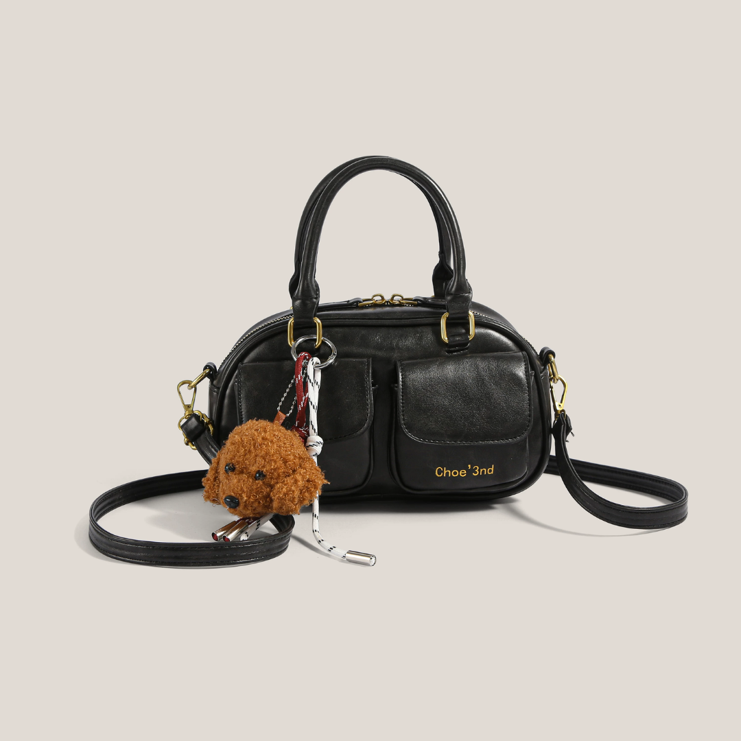 bolso de mano compacto con bolsillo frontal. Phoebe