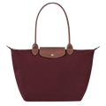 bolsa de tela técnica con detalles en cuero. Silvana