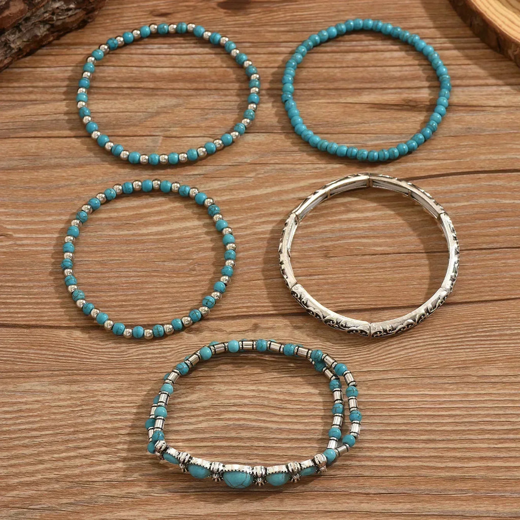 set de pulseras con perlas turquesas y detalles plateados. Diane